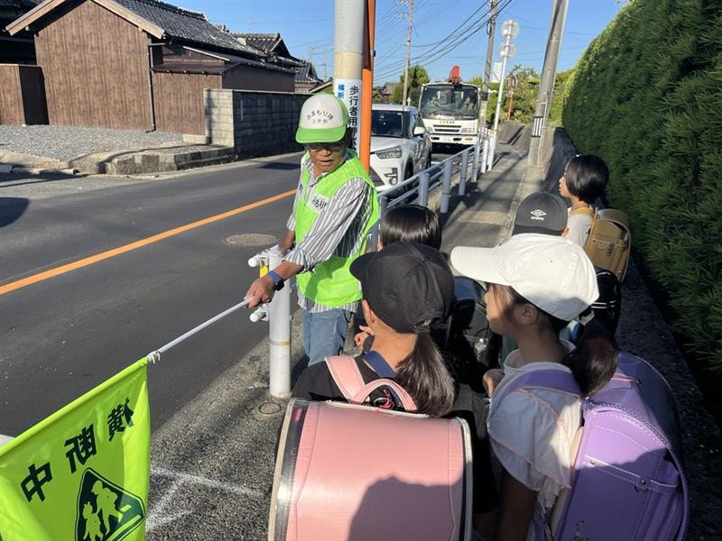 信号待ちでの地域の方との会話